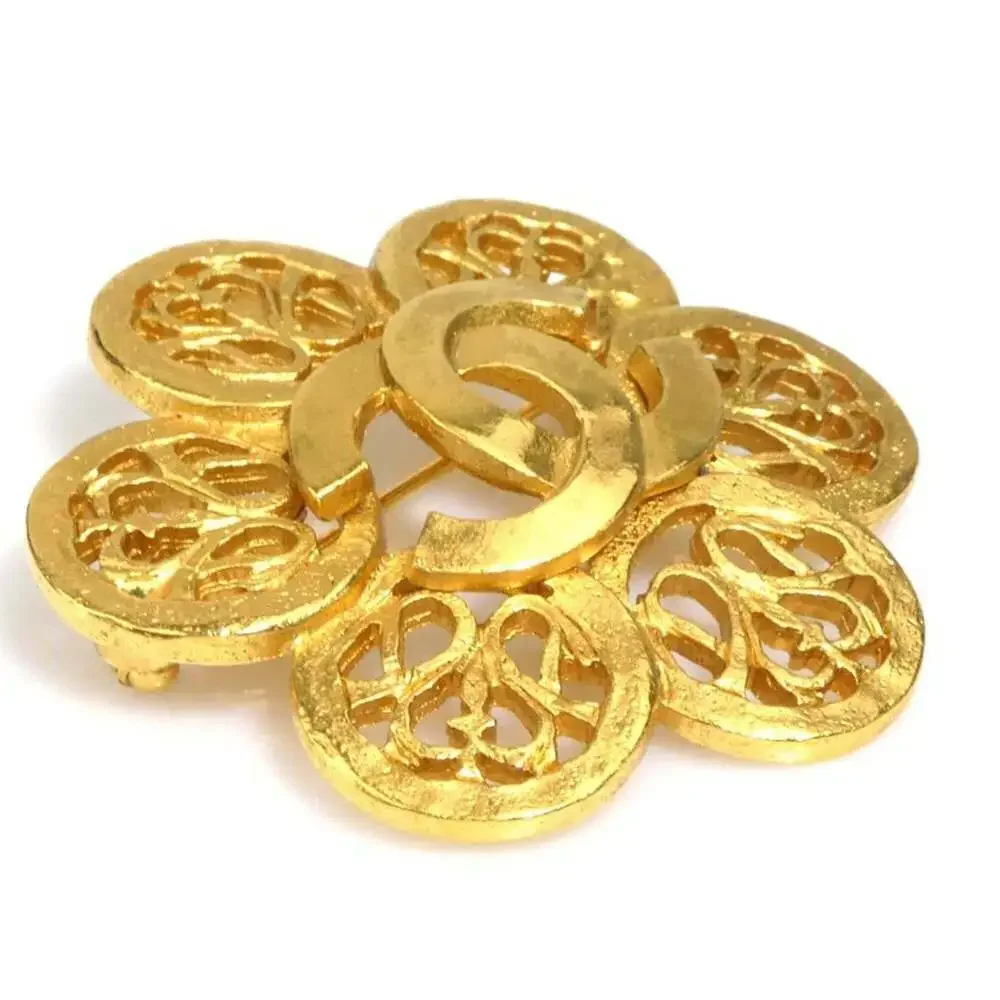 CHANEL Gold Logo Brooch